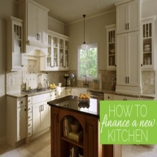 text how to finance your new kitchen overlaid on image of kitchen with white shaker glass door cabinets and dark cherry center island