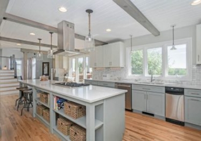 open gray kitchen design with island with open shelves for storage space.