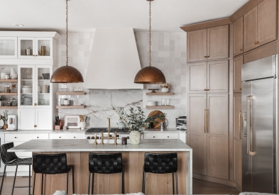 Shaker White and wood tone kitchen with cream marble countertops with brown veining