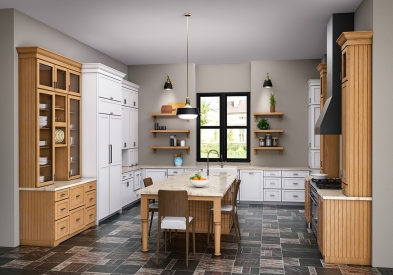 Large white and stained maple kitchen with furniture-like cabinets and large island with decorative legs