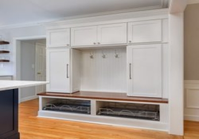 white mudroom cabinets with open shelving and beadboard back using CliqStudios Dayton cabinets.