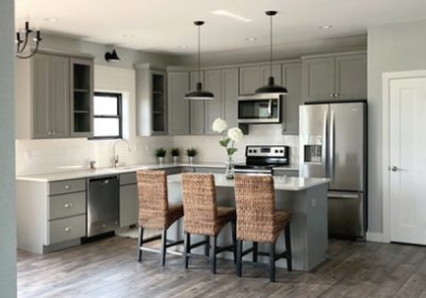 For this project, CliqStudios Pro Partner Sarah chose Medium Gray cabinets because they spoke casual and modern for this open kitchen design