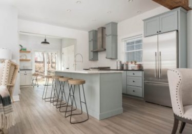 One-wall light gray shaker kitchen design with stacked cabinets and kitchen island