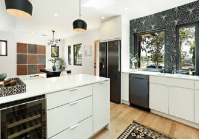 White slab kitchen cabinets with black starburst wall paper in Mid-Century Modern design style