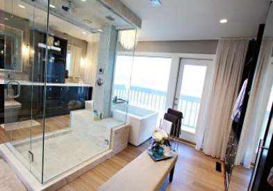 Open-concept bathroom combining shower, floating bath, double vanity, and dressing closet.