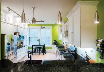 Located in Lexington, Georgia, this kitchen renovation features Shaker Painted White cabinets allowing for a bright pop of color on the walls.