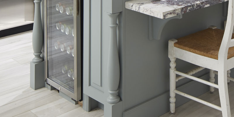 Decorative in blue-gray round kitchen island legs.