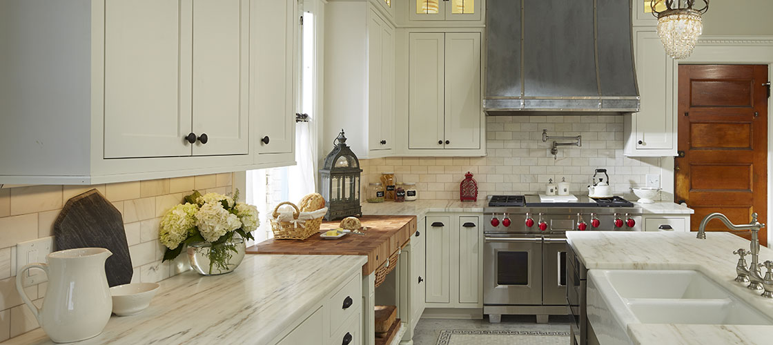 CliqStudios inset cabinetry in painted white and green