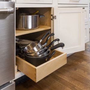 White shaker base cabinet with one roll-out tray on the bottom shelf