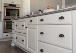 white base cabinet drawers with cup pulls