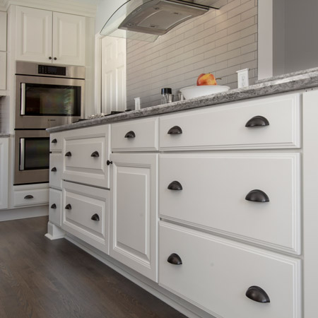 white base cabinet drawers with cup pulls