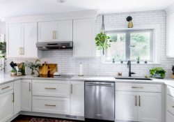 A white kitchen using CliqStudios Shaker cabinets, with white subway tile backsplash and countertop.