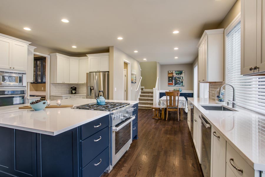 Dayton White and Navy kitchen storage cabinets with white quartz countertops