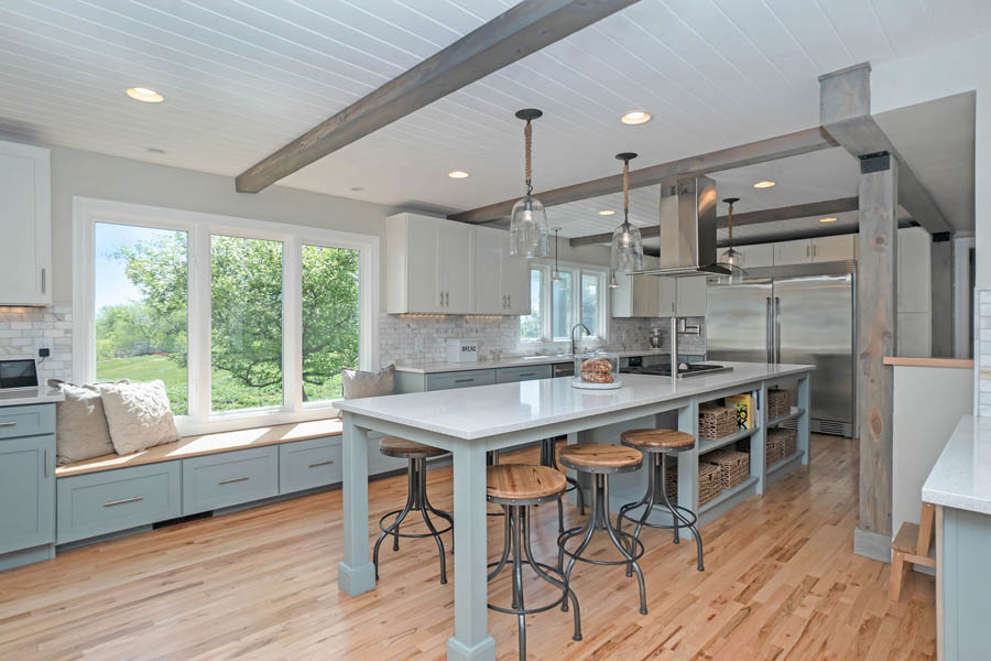 window seat using blue gray kitchen cabinets.