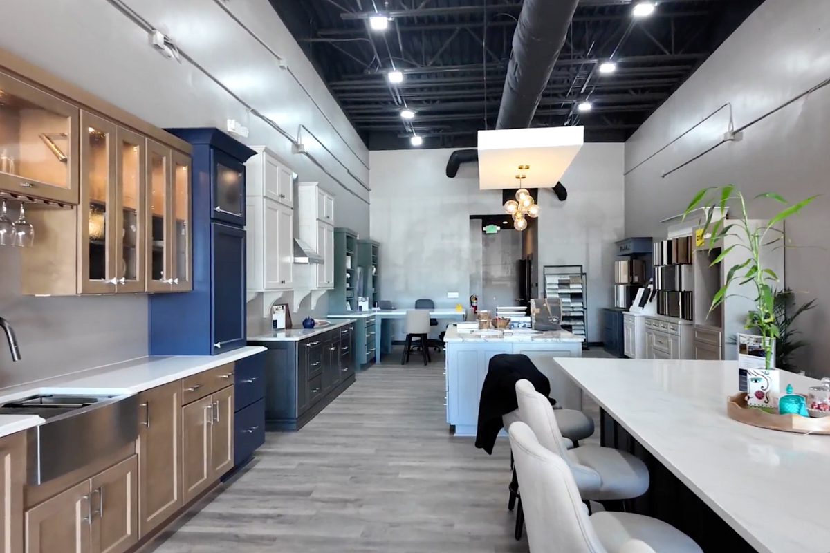 Large CliqStudios showroom in Buford Georgia with shaker cabinet displays in white, navy, and light wood tones with door displays