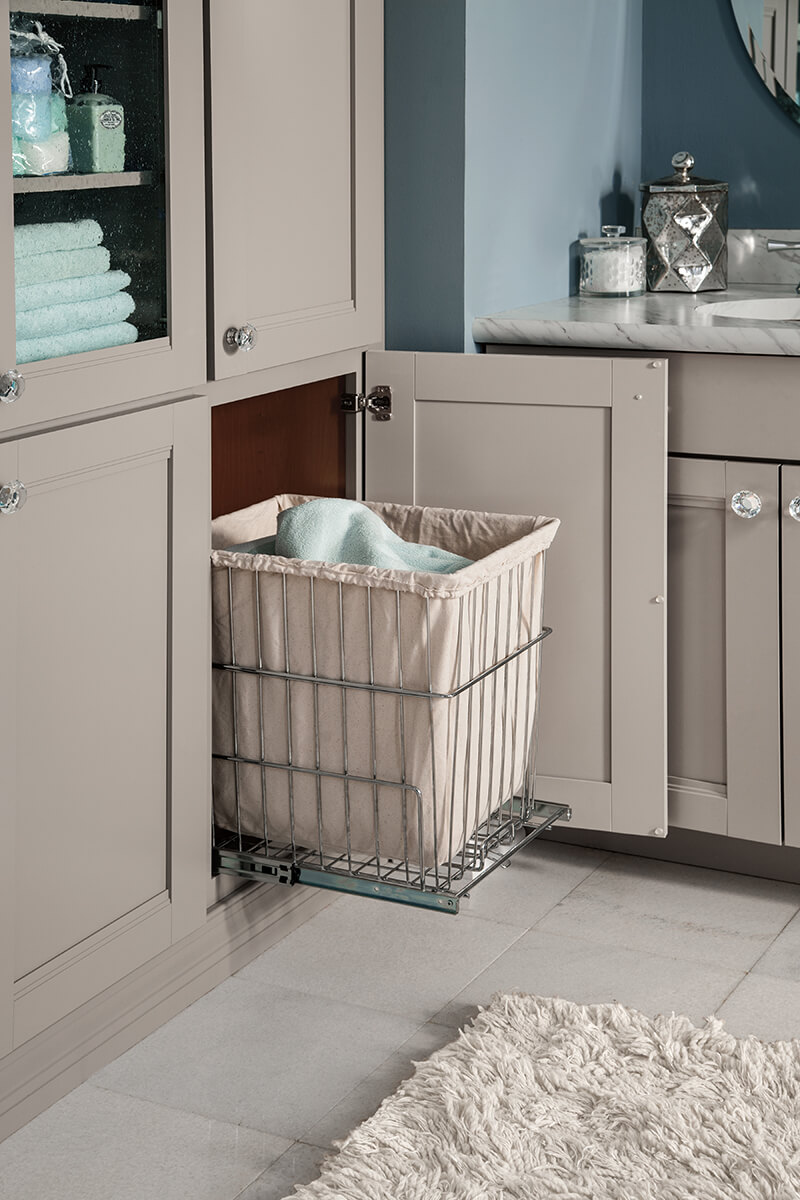 The image is of a tall corner cabinet with doors in bathroom suite. Tall corner cabinets with doors are effective as they have multiple adjustable shelves for storing endless bathroom supplies.