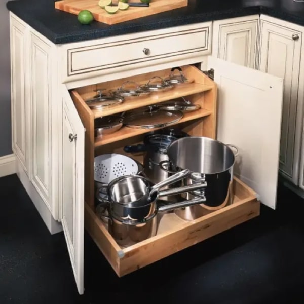 Base pots and pans pull-out organizer in cream raised panel cabinets