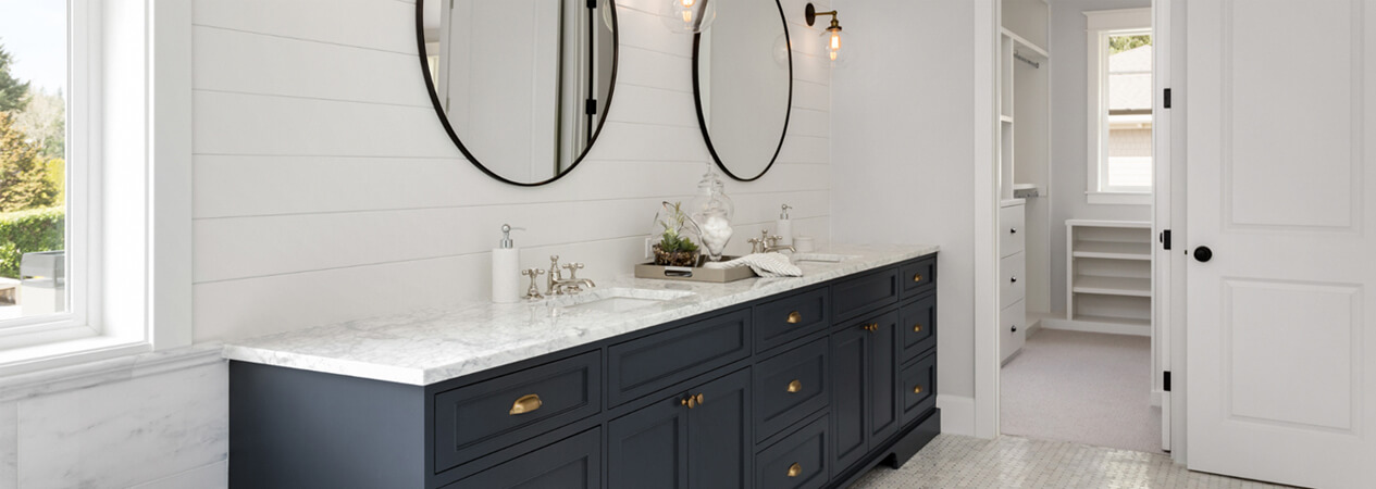 Black inset double bathroom vanity with white marble countertops