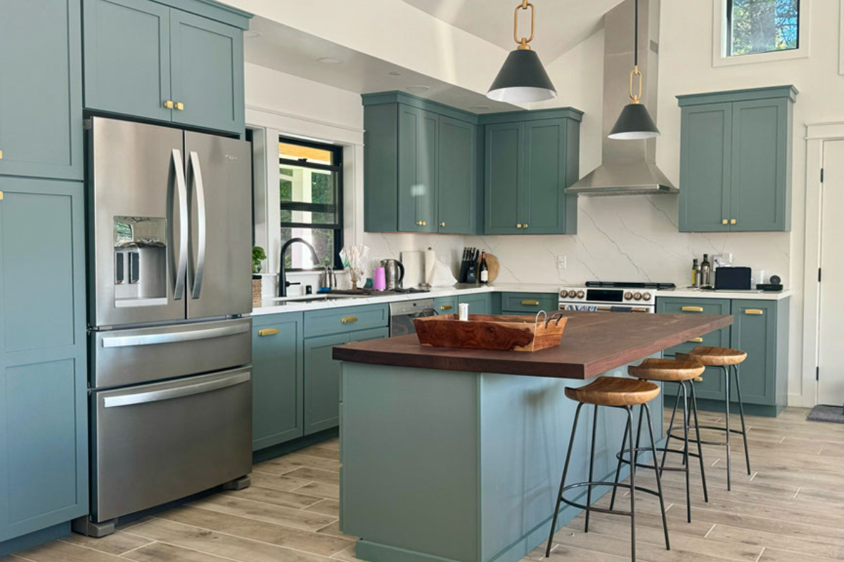 Aqua blue shaker kitchen design with vaulted ceilings and a dark wood butcher block countertop Aqua blue shaker kitchen design with vaulted ceilings
