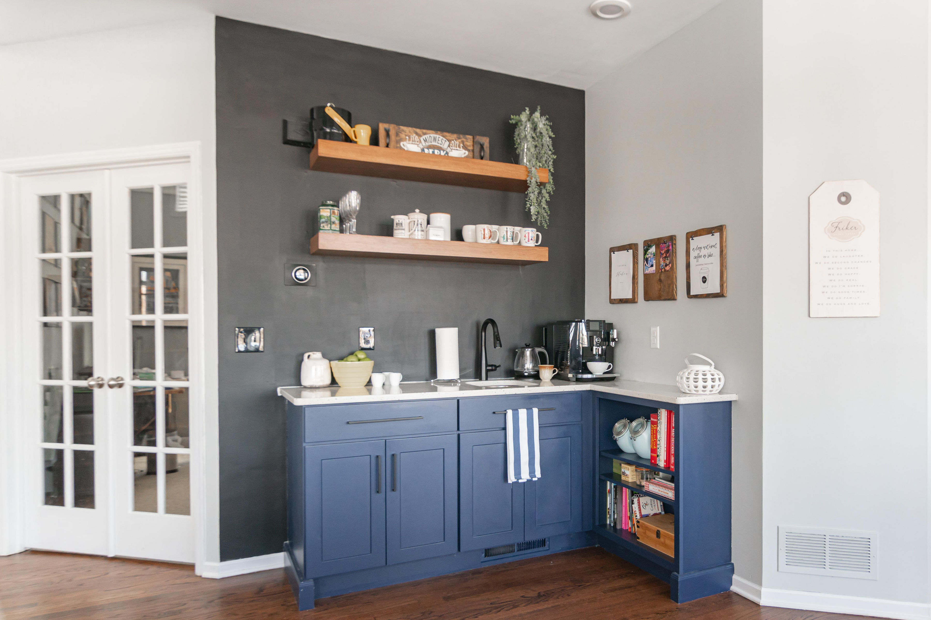 CliqStudios project: Shaker blue coffee bar cabinets with warm wood floating shelves