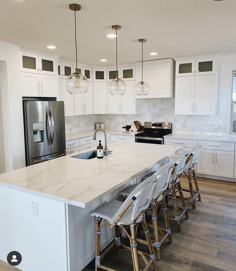 Wood Range Hood Cover with other kitchen appliances in a White Kitchen Cabinets