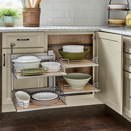 Blind corner base kitchen cabinet with pull-out trays that pivot for storage