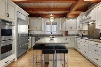 Beautiful white kitchen with CliqStudios white kitchen cabinets and kitchen island seating.