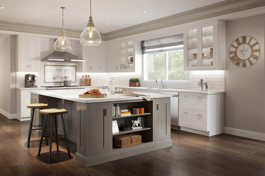 Transitional style two-tone kitchen with inset Shaker cabinets, large gray island with open shelving, white perimeter cabinets with glass front cabinets surrounding the window and sink