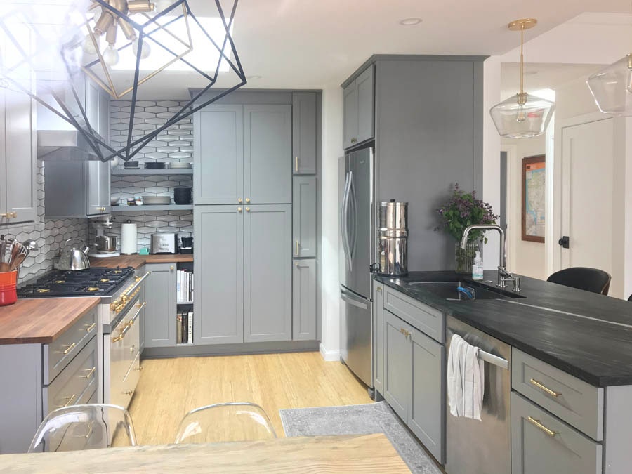 small kitchen with medium gray cabinets.