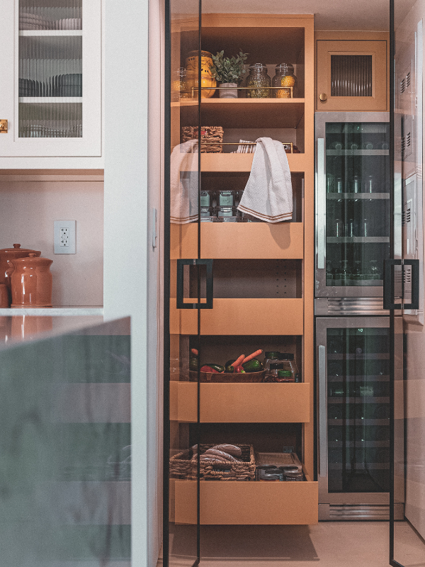 Kitchen pantry cabinets in yellow inset kitchen cabinets with reeded glass and natural stone countertop