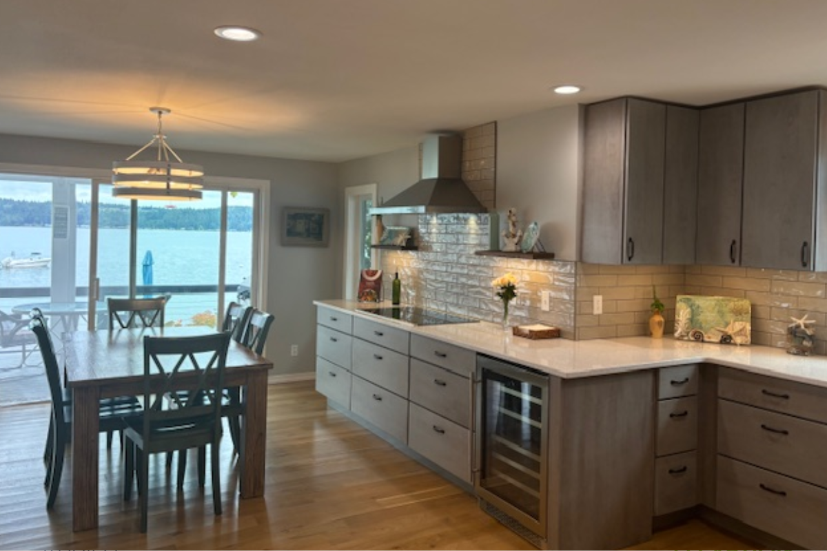 Contemporary gray slab door kitchen with wood floating shelves and white quartz countertops 