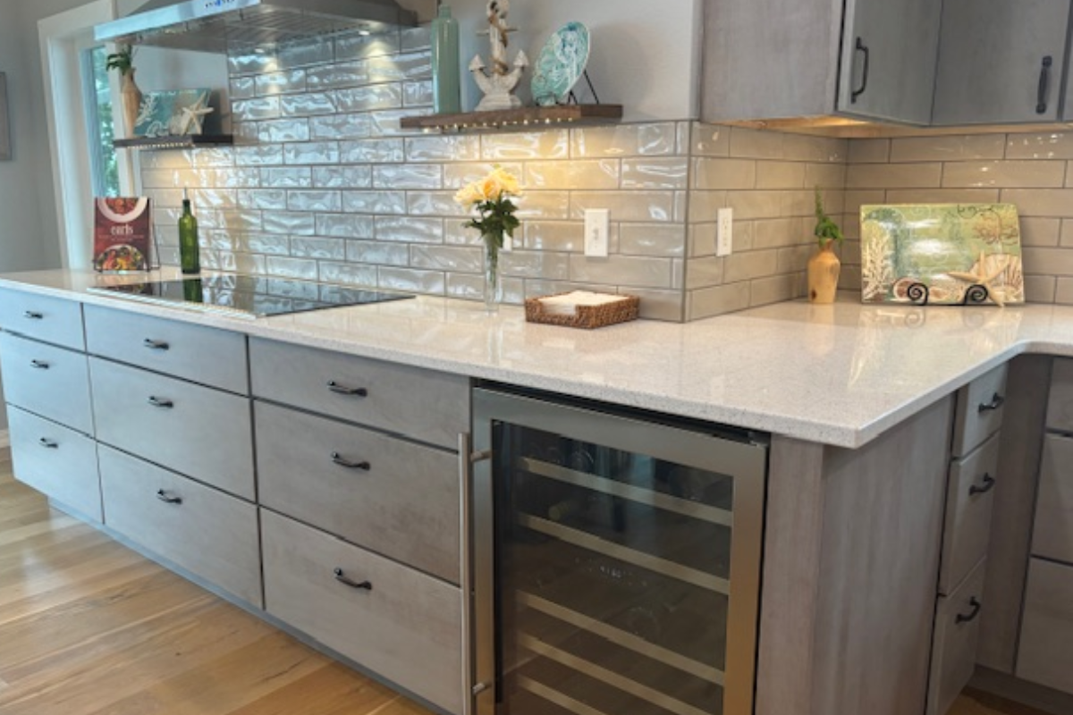 Contemporary gray slab door kitchen with wood floating shelves and white quartz countertops 