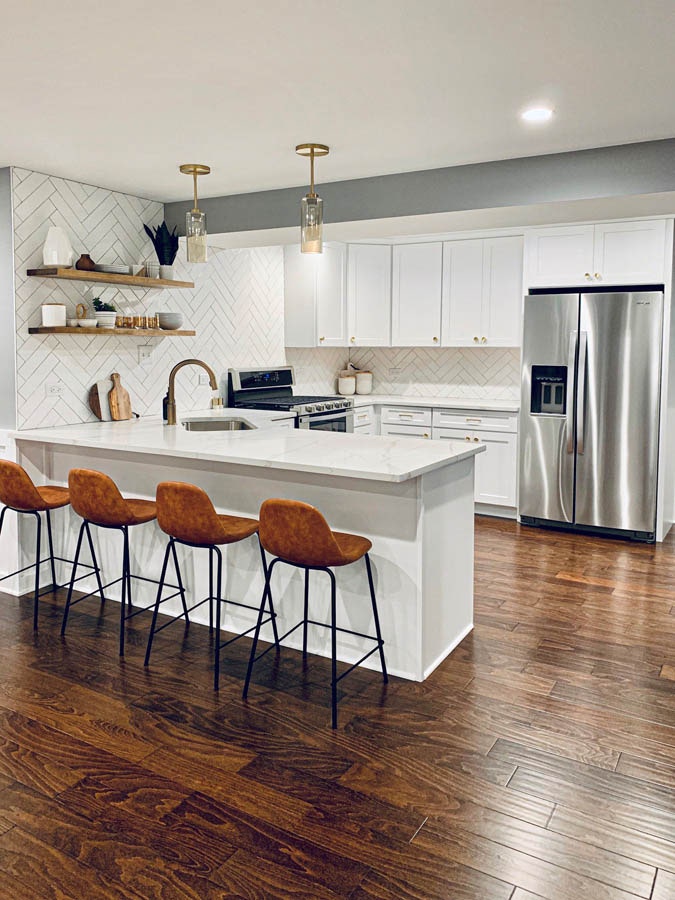 White kitchen with peninsula.