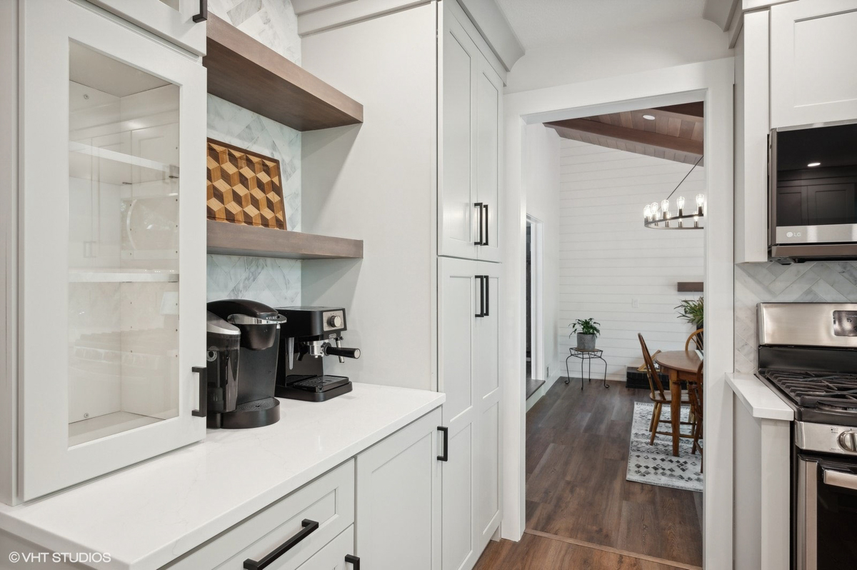 Light gray shaker kitchen cabinets with peninsula design 