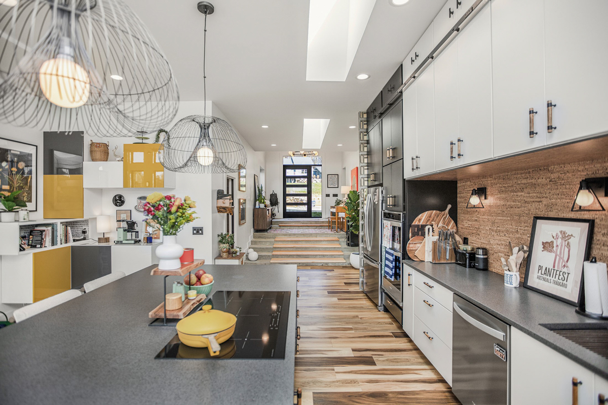 White and black slab door kitchen design with gray countertops and eclectic details