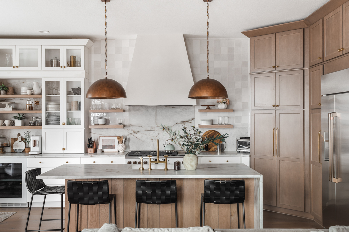 Stacked white shaker kitchen cabinet with light wood shaker refrigerator surround and island