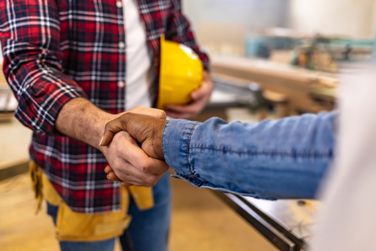 Contractor and homeowner shaking hands