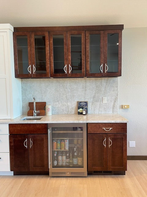 Built-in beverage bar in dark brown wood shaker cabinets