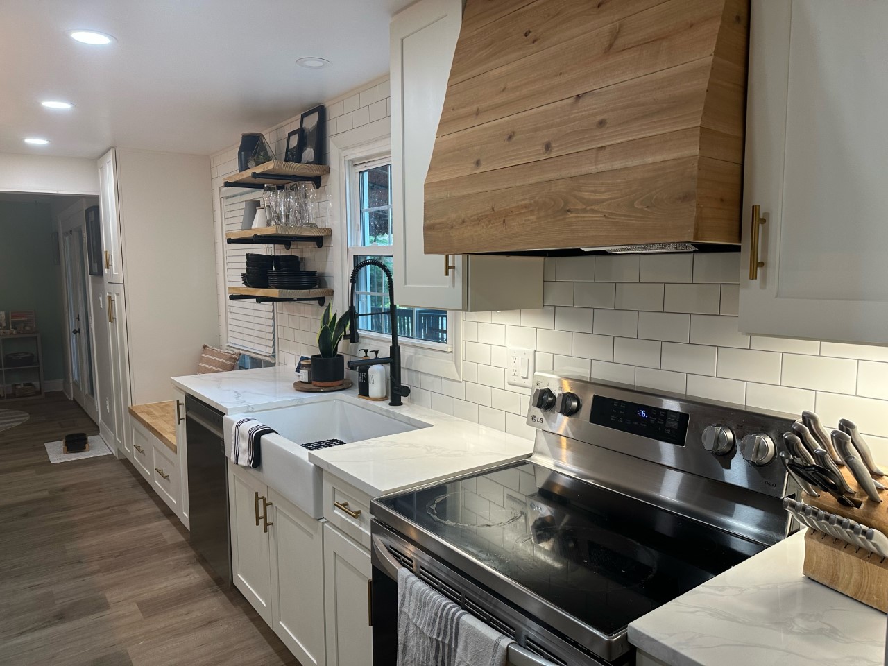 CliqStudios project: White shaker kitchen with pine wood hood and light gray island cabinets