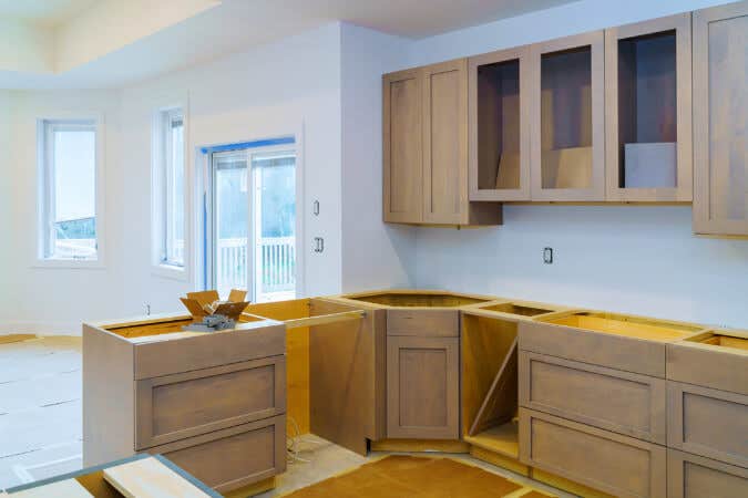 Kitchen cabinet installation of light wood shaker cabinets 