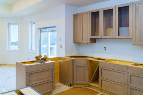 Kitchen cabinet installation of light wood shaker cabinets