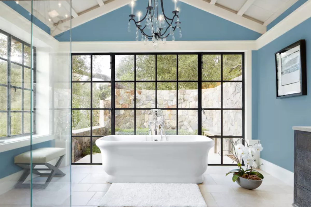 Robins egg blue in large master bathroom with white freestanding bathtub