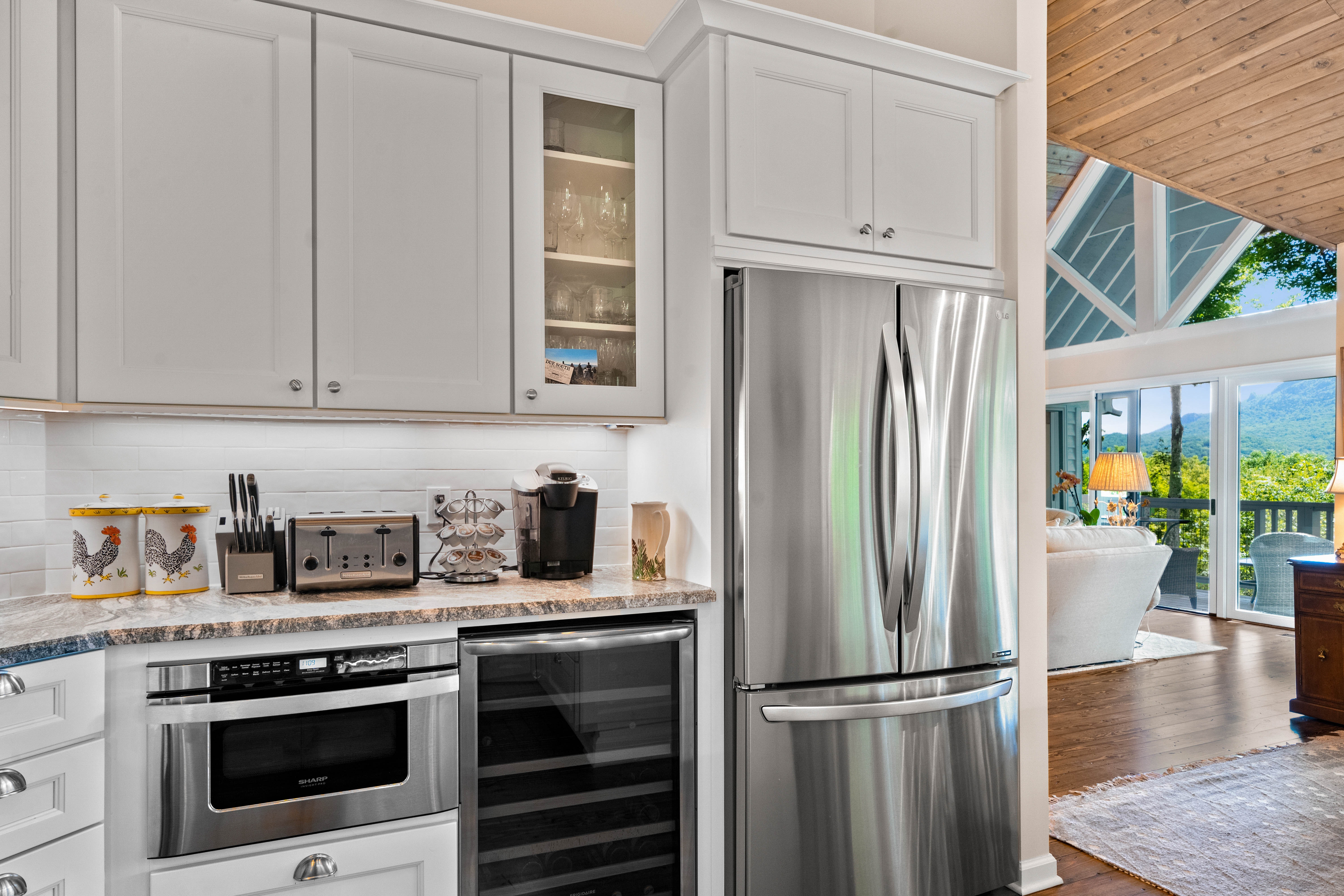 White shaker kitchen cabinets with stainless steel appliances