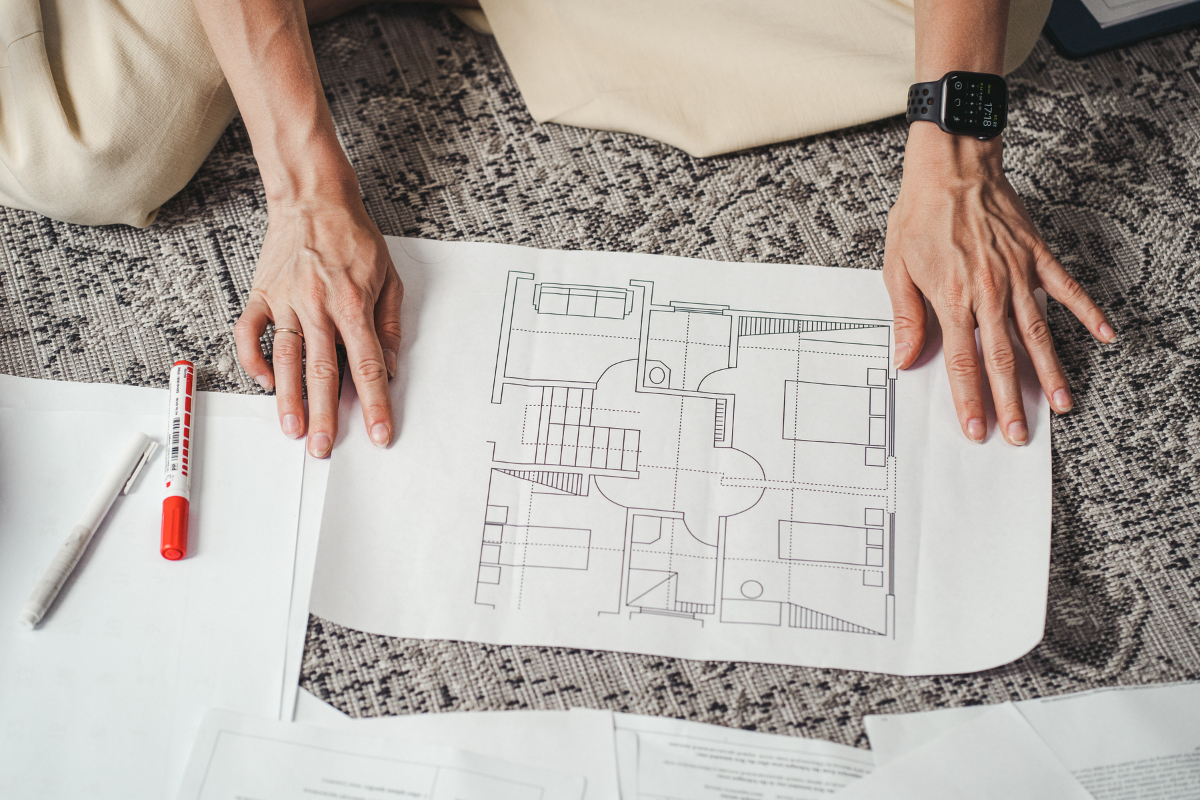 Printed kitchen floorpans laid out on the floor