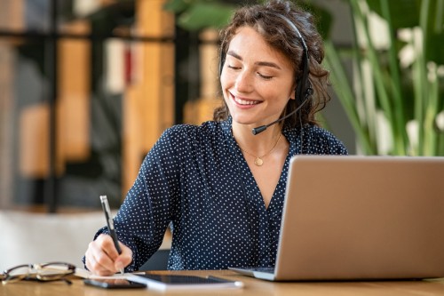 Business woman on the phone smiling 