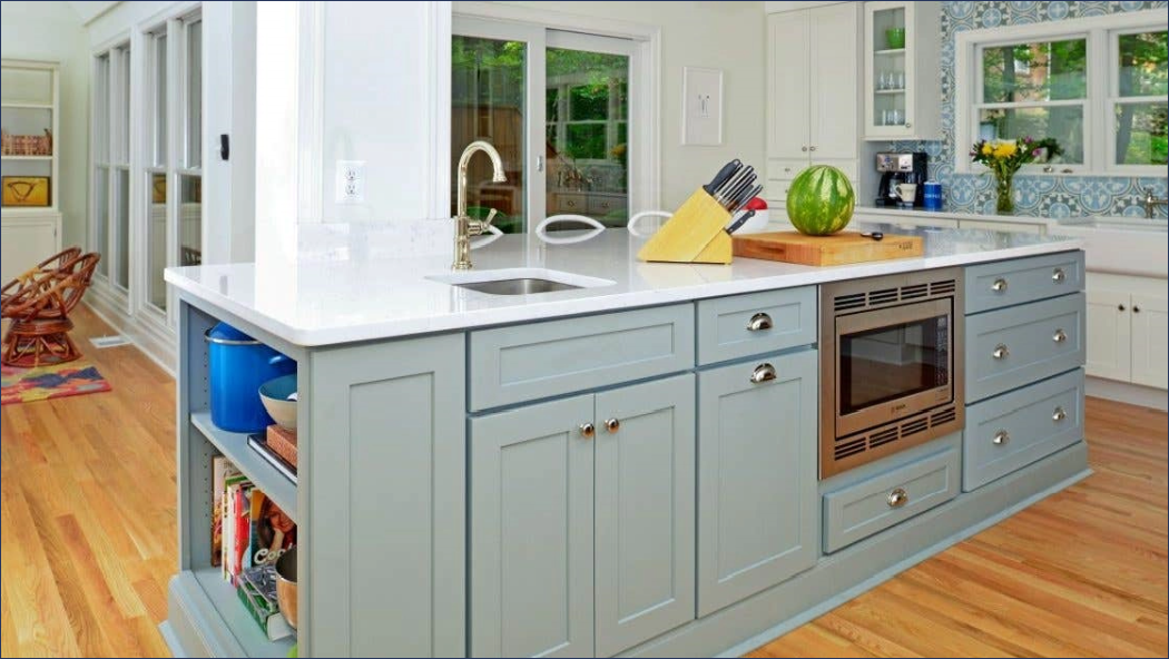 Light gray shaker kitchen cabinet island with open shelves