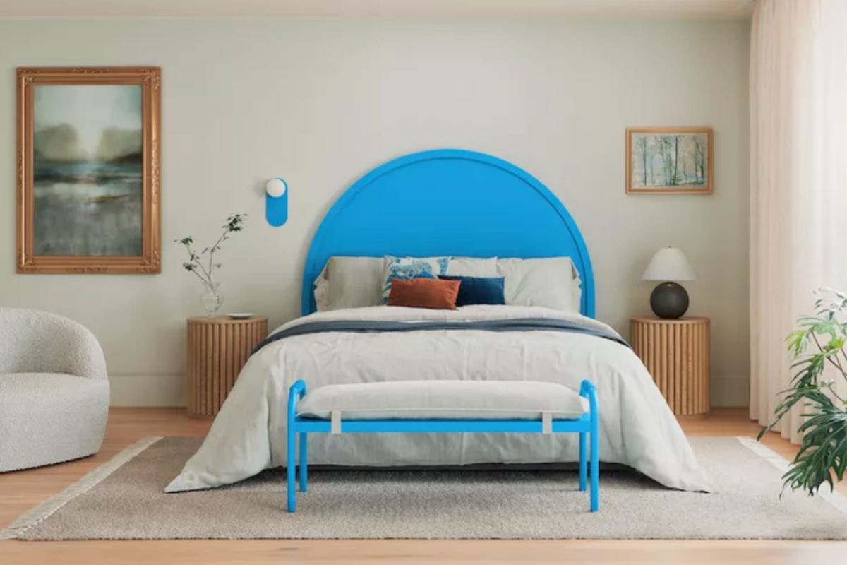 Electric blue wooden headboard in a white bedroom