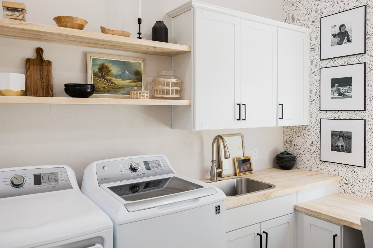 White shaker laundry room cabinets