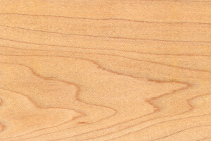 Maple wood with light pink undertones and soft grain patterns