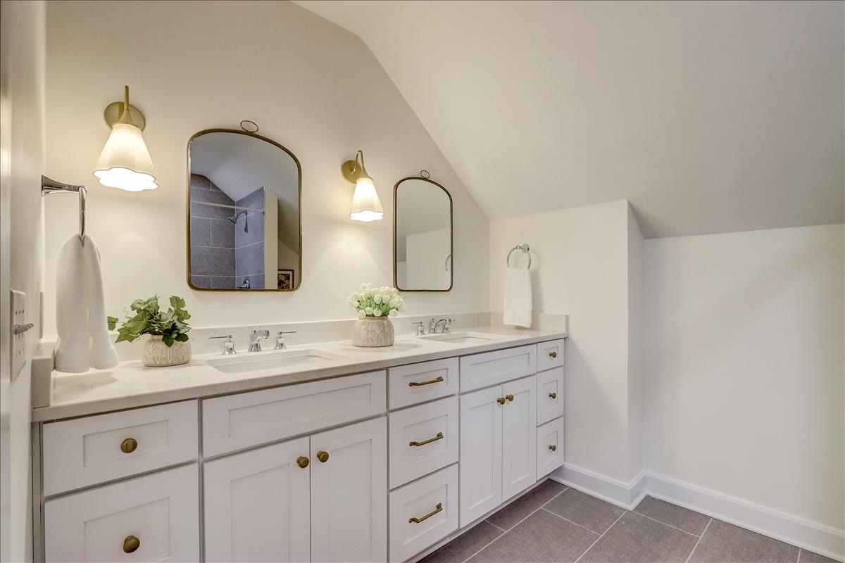 CliqStudios project: Shaker white bathroom vanity cabinets with gold accents